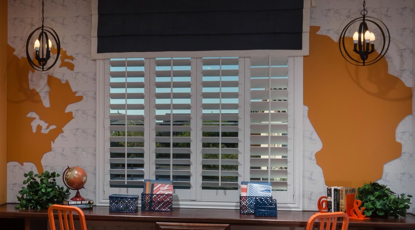 Plantation shutters over a desk